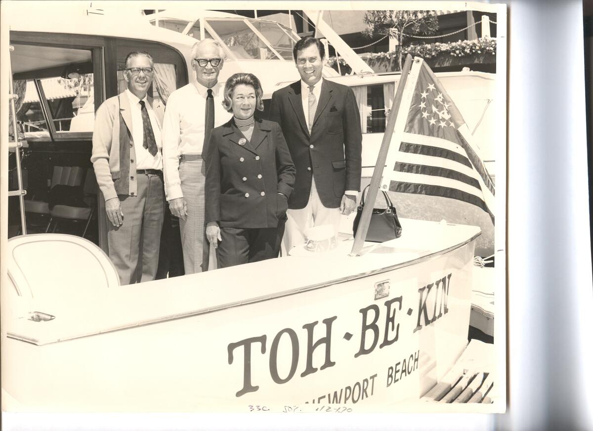 Barry and Margaret Goldwater alongside Jack Richardson, right, aboard the TOH-BE-KIN. The man on the left is unidentified.