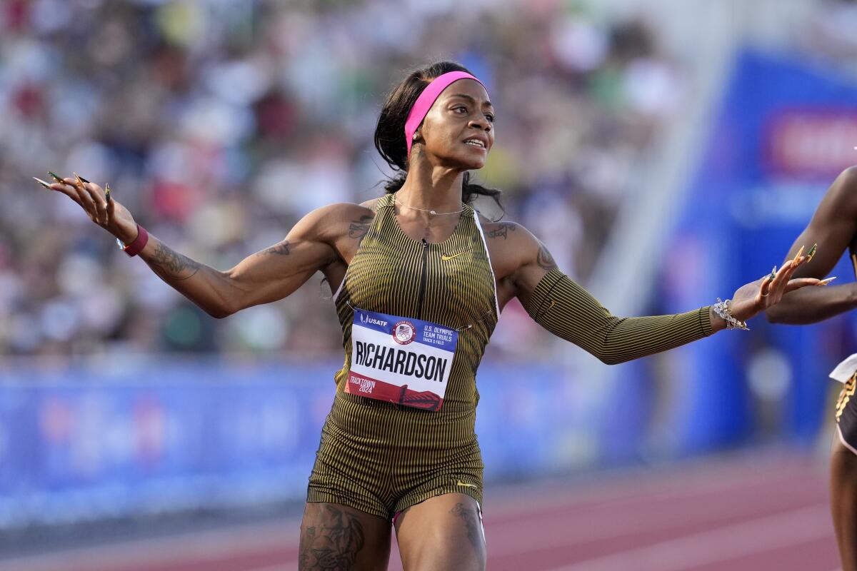 American sprinter Sha'Carri Richardson reacts after winning a 100 meters race.