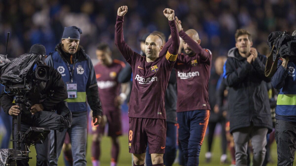 Barcelona's Andres Iniesta and teammates celebrate after winning the 2017-18 Spanish La Liga title.