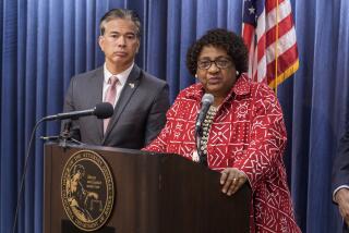 California Attorney General Rob Bonta, left, Secretary of State Shirley Weber takes questions after announcing a lawsuit to protect voter rights at a news conference at the California Department of Justice in Los Angeles Monday, April. 15, 2024. (AP Photo/Damian Dovarganes)