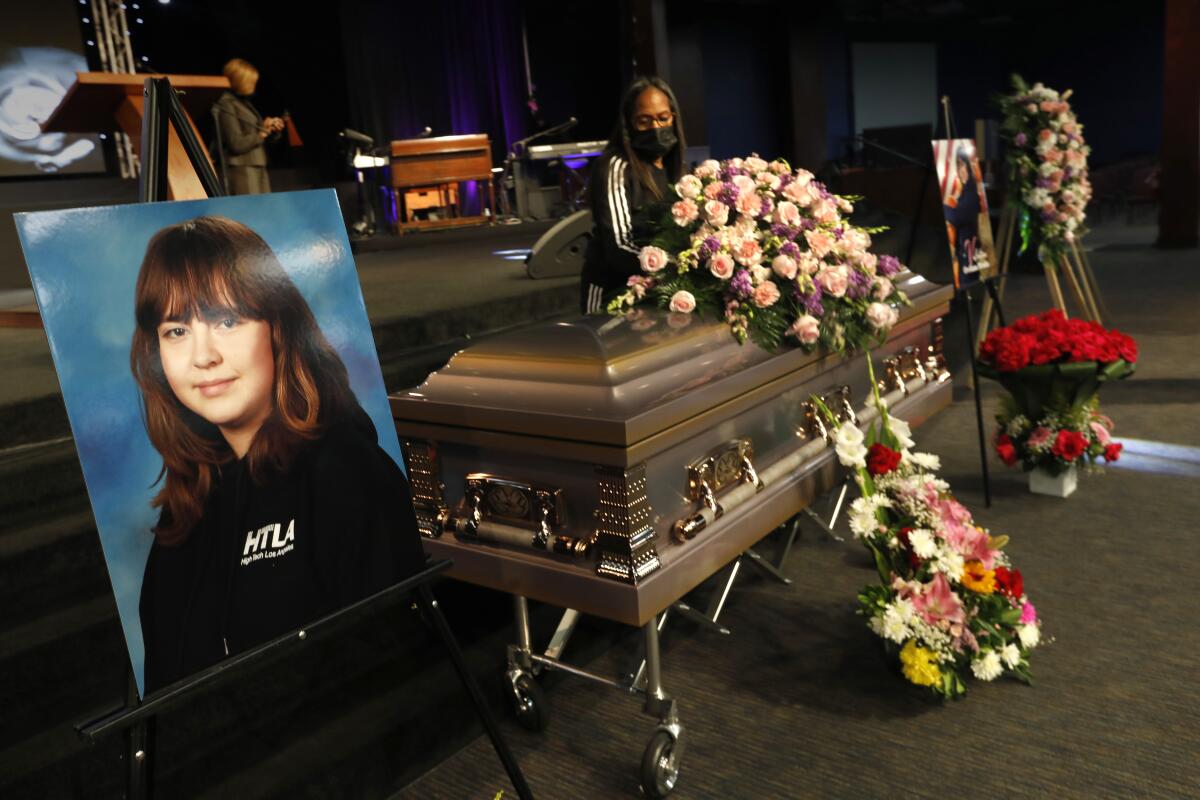 Flowers are placed on the casket of Valentina Orellana Peralta, by Jackie Williams