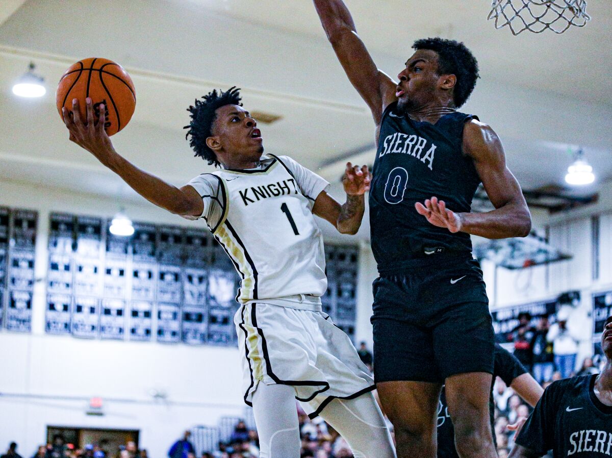 Bishop Montgomery's LaQwon Cole, left, puts up a shot in front of Sierra Canyon's Bronny James.