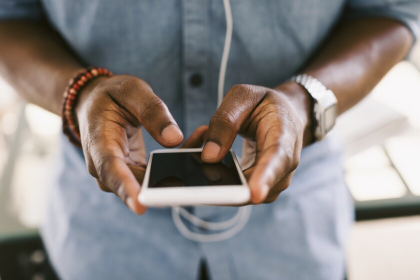 A man holds a smartphone.