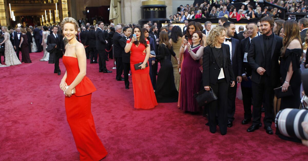 Oops! Jennifer Lawrence falls again, this time on Oscar red carpet