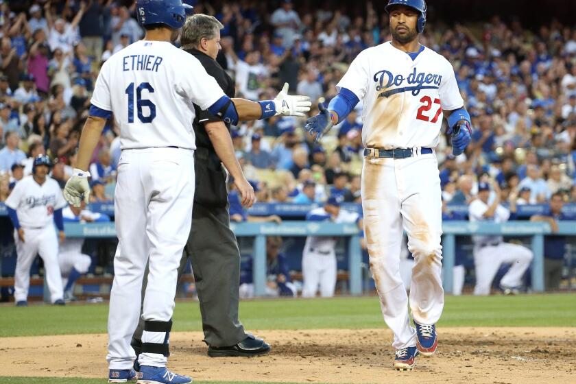 Matt Kemp scores the Dodgers' lone run against the White Sox on a sacrifice fly in the second inning of Tuesday's 4-1 loss to Chicago.