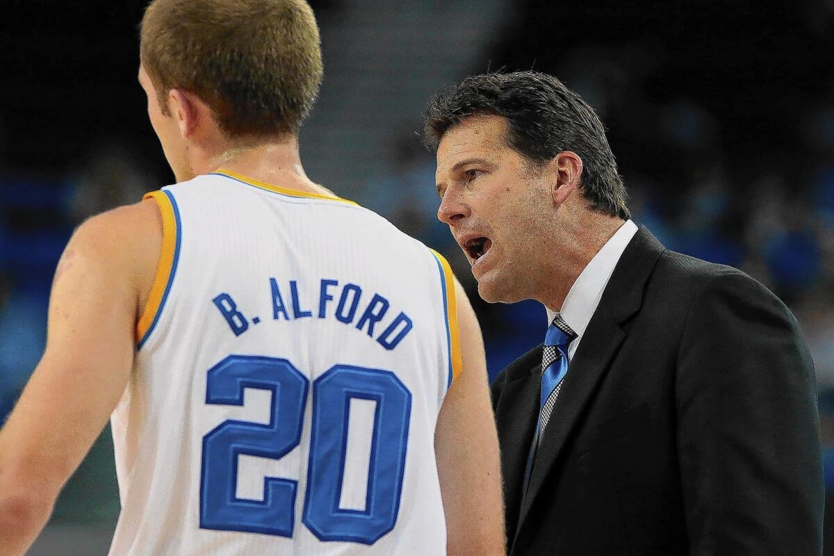 UCLA coach Steve Alford gives instructions to son Bryce.