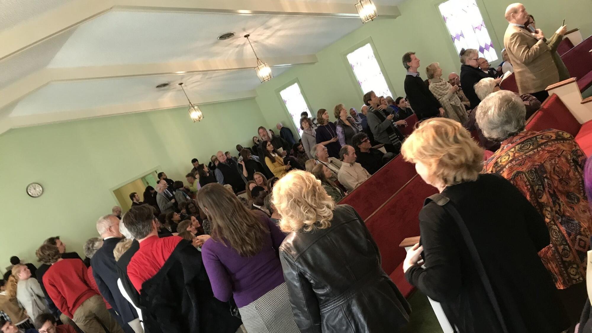 Visitors to the Maranatha Baptist Church in Plains, Ga., queue up for photos with former President Jimmy Carter 