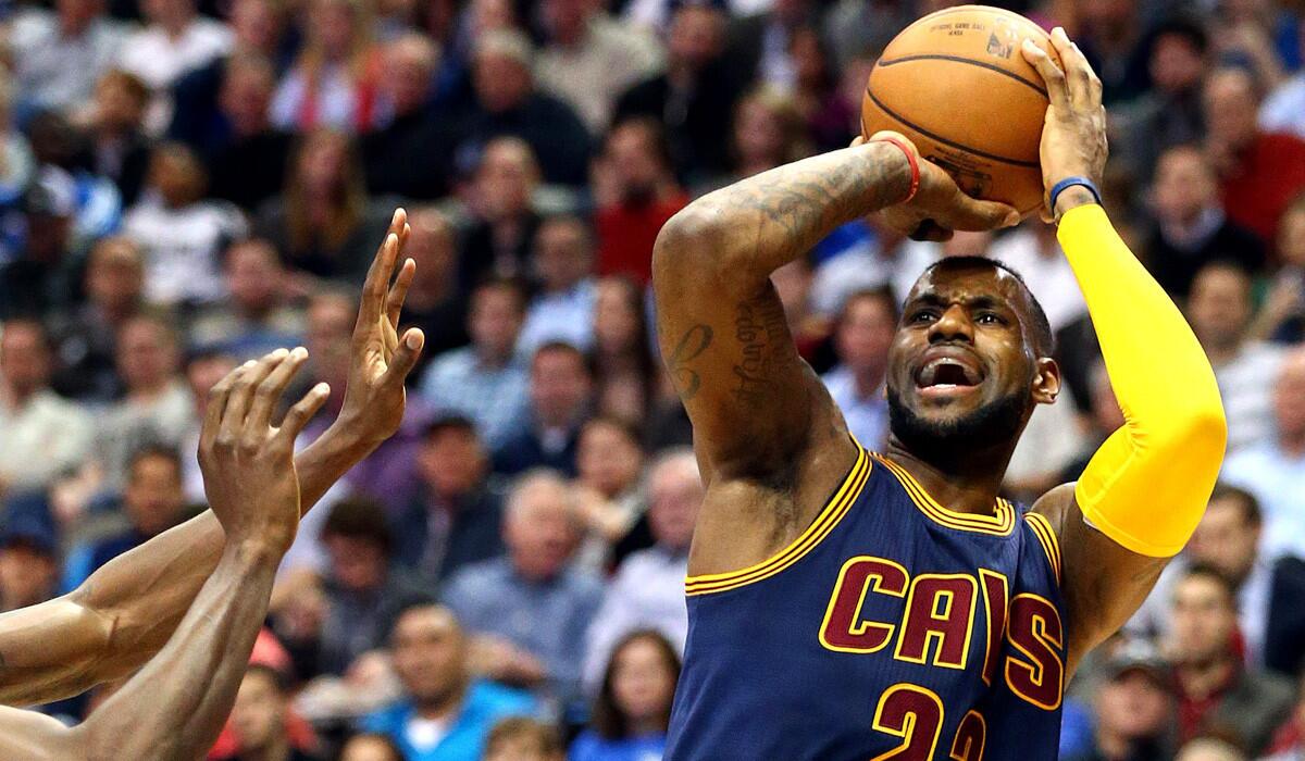 Cleveland's LeBron James takes a shot during the Cavaliers' 127-94 victory over the Dallas Mavericks on Tuesday.