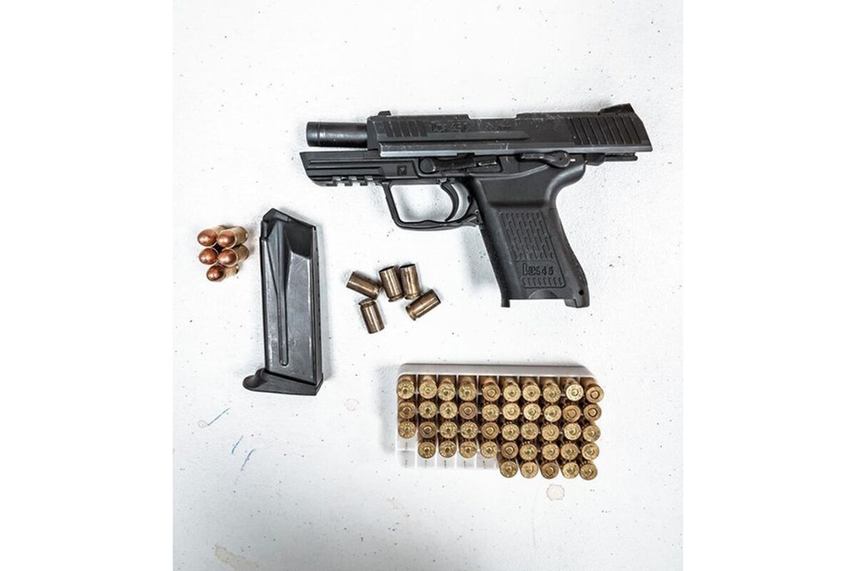 This evidence photo released by the Los Angeles Police Department, Hollywood Division, shows a handgun and ammunition retrieved after LAPD arrested a man suspected of firing a gun from his apartment balcony on Hollywood Boulevard in Los Angeles on Sunday, Dec. 12, 2021. Witnesses said they heard four or five shots Sunday evening and saw a person's arm holding a handgun from an upper-story apartment, as fans of the late Mexican singer Vicente Fernandez gathered for a vigil across the street, according to the Los Angeles Times. (LAPD Hollywood Division via AP)
