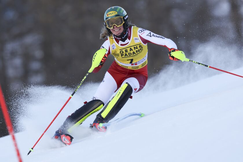 FILE - Austria's Katharina Liensberger speeds down the course during the first run of an alpine ski, women's World Cup slalom, in Sestriere, Italy, Sunday, Dec. 11, 2022. Once known as skiing’s “Wunderteam” for its domination of the ski racing circuit, Austrian men and women have both been struggling for results this season while Austrian coaches are lending their expertise to other nations. (AP Photo/Alessandro Trovati, File)