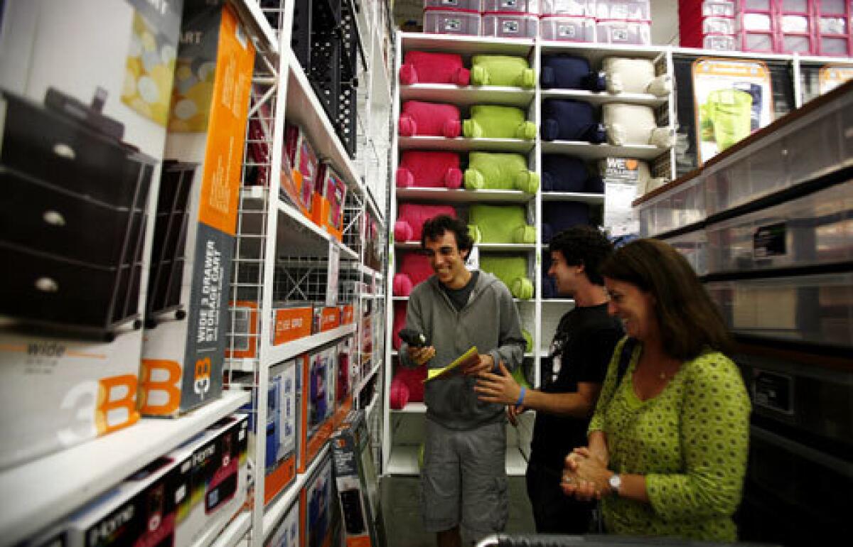 GETTING READY: Sharon Lerman shops with her son Ben, center and his friend Daniel Gordon at Bed Bath & Beyond in Los Angeles.