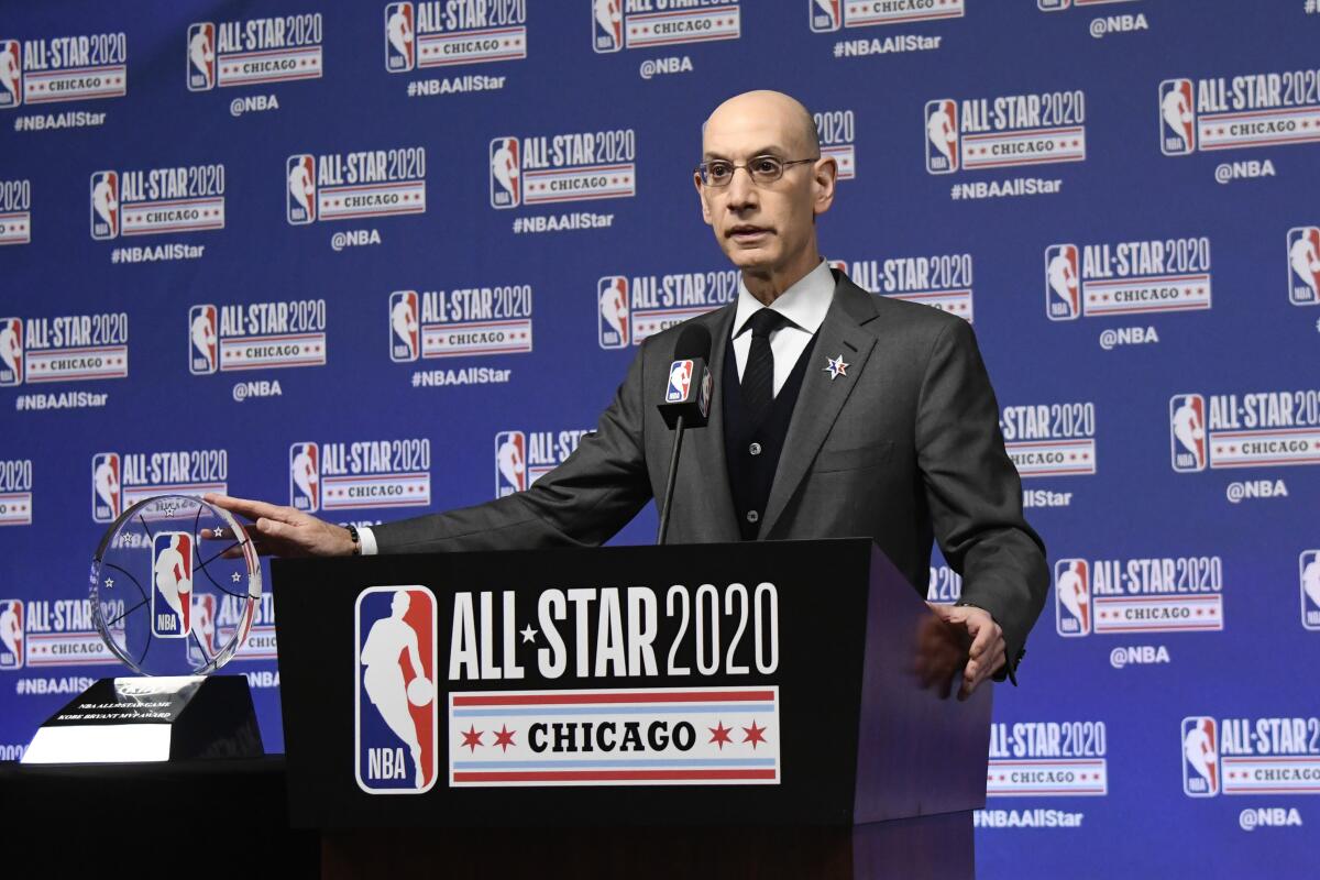 FILE - In this Feb. 15, 2020, file photo, NBA Commissioner Adam Silver unveils the NBA All-Star Game Kobe Bryant MVP Award during a news conference in Chicago. Silver was discussing the league’s ongoing pandemic response and plans for next season on Saturday in his annual address at the All-Star Game. This year’s game is Sunday in Atlanta. (AP Photo/David Banks)