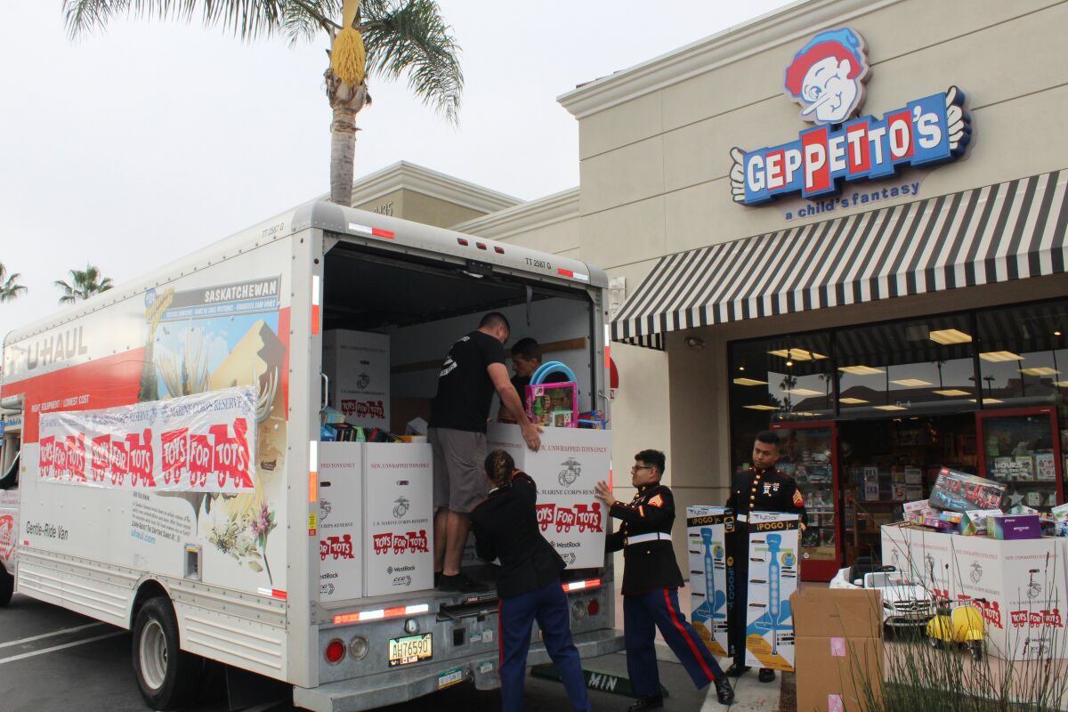The Marines helped load up toy donations at Geppetto's on Nov. 11.