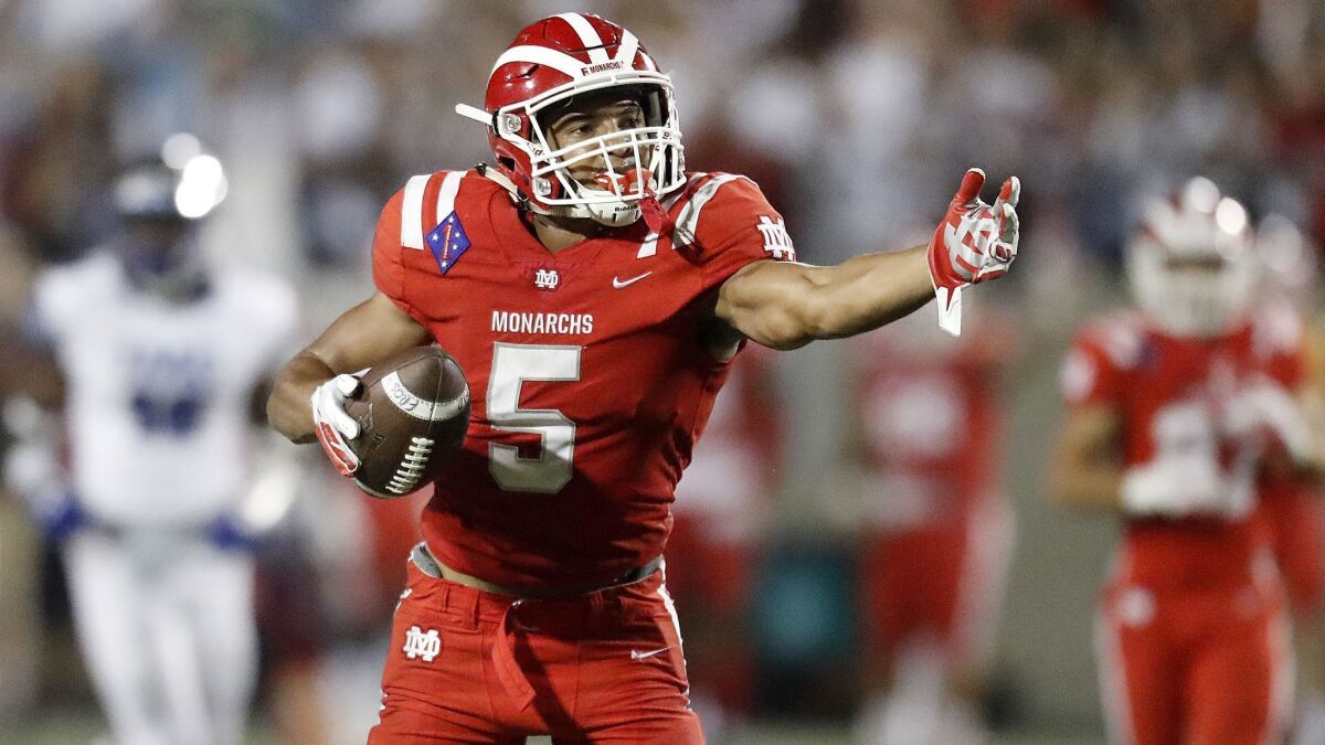 Mater Dei receiver Bru McCoy signals a first down after making a catch against IMG Academy on Sept. 21, 2018, at Santa Ana Stadium.