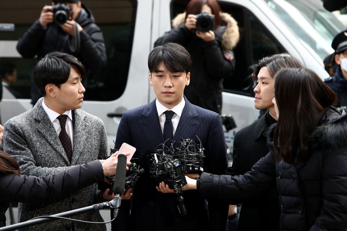 Seungri, formerly a member of South Korean boy band BIGBANG is seen arriving at a Seoul Metropolitan Police Agency on March 14, 2019 in Seoul, South Korea.