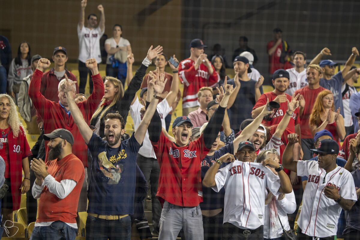 Red Sox fans celebrate after winning the World Series 5-1 over the Dodgers in Game 5 at Dodger Stadium.