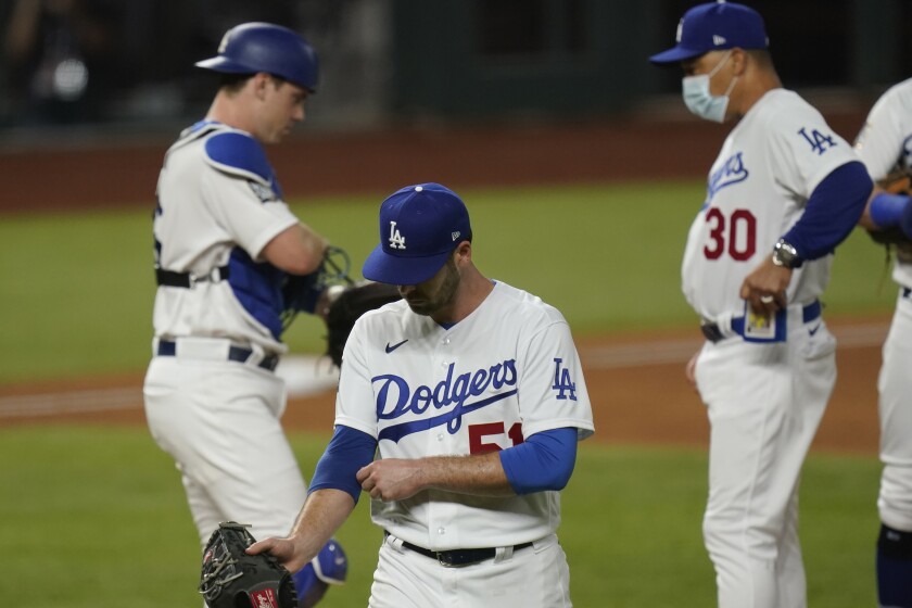 Dodgers relief pitcher Dylan Floro leaves the game against the Tampa Bay Rays during the third inning.