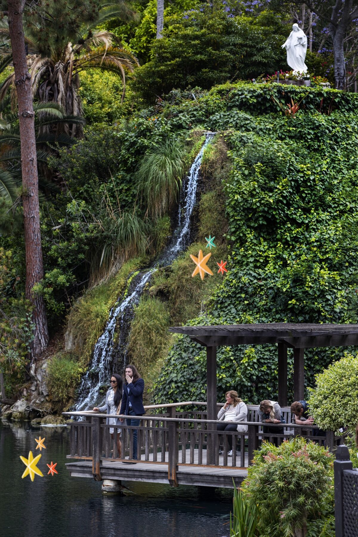 Visitors enjoy the Meditation Gardens at the Self-Realization Fellowship Lake Shrine in Pacific Palisades.