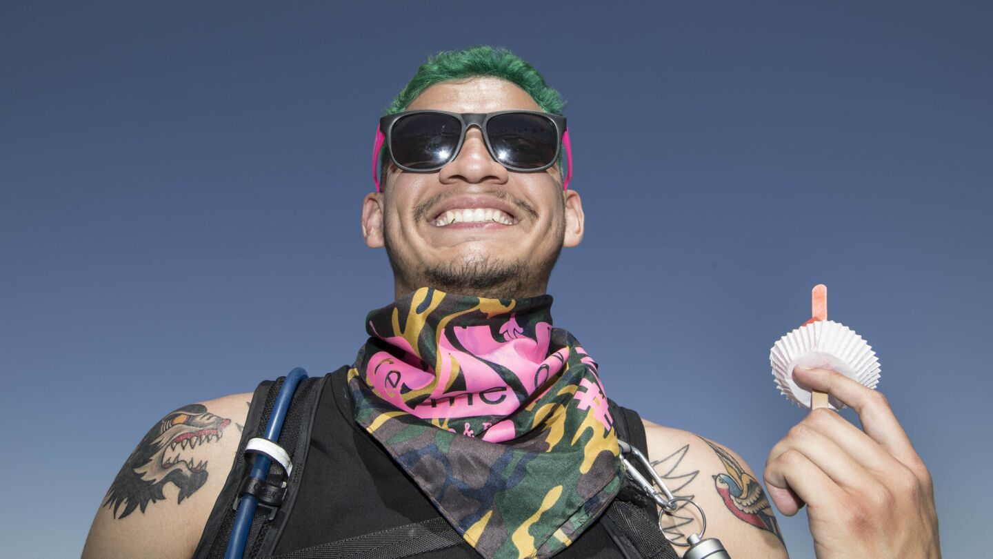INDIO, CALIF. -- SATURDAY, APRIL 15, 2017: Anaheim resident Albert De La Riva, 24, is a face in the crowd at the Coachella Music and Arts Festival in Indio, Calif., on April 15, 2017. (Brian van der Brug / Los Angeles Times)