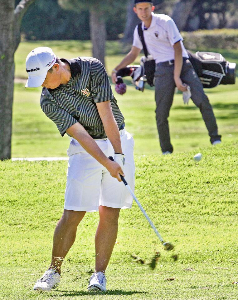 Collin Morikawa, on the first fairway, hits for the green at Brookside Golf Course in Pasadena in a non-league boys golf match between La Canada and St. Francis on Monday, April 7, 2014.