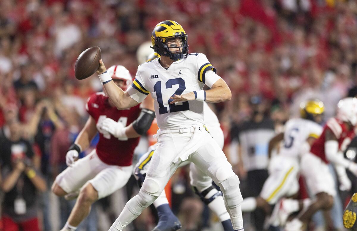 Michigan quarterback Cade McNamara passes against Nebraska on Oct. 9.
