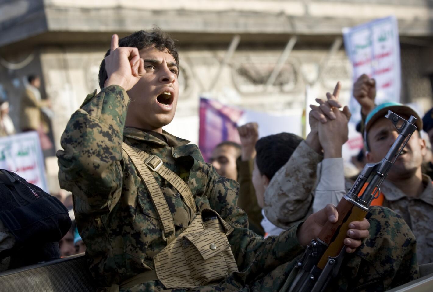 A Houthi Shiite fighter wearing an army uniform chants during a demonstration in Sana, Yemen.