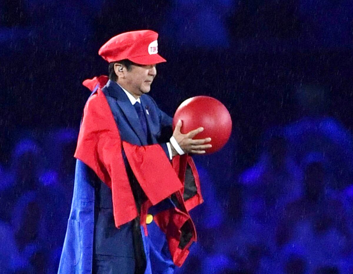 FILE - Then Japanese Prime Minister Shinzo Abe appears as the Nintendo game character Super Mario during the closing ceremony at the 2016 Summer Olympics in Rio de Janeiro, Brazil on Aug. 21, 2016. Despite his fame as a Japan's longest serving prime minister, Shinzo Abe might have had enjoyed his biggest moment at the closing ceremony of the 2016 Rio de Janeiro. (Yu Nakajima/Kyodo News via AP, File)
