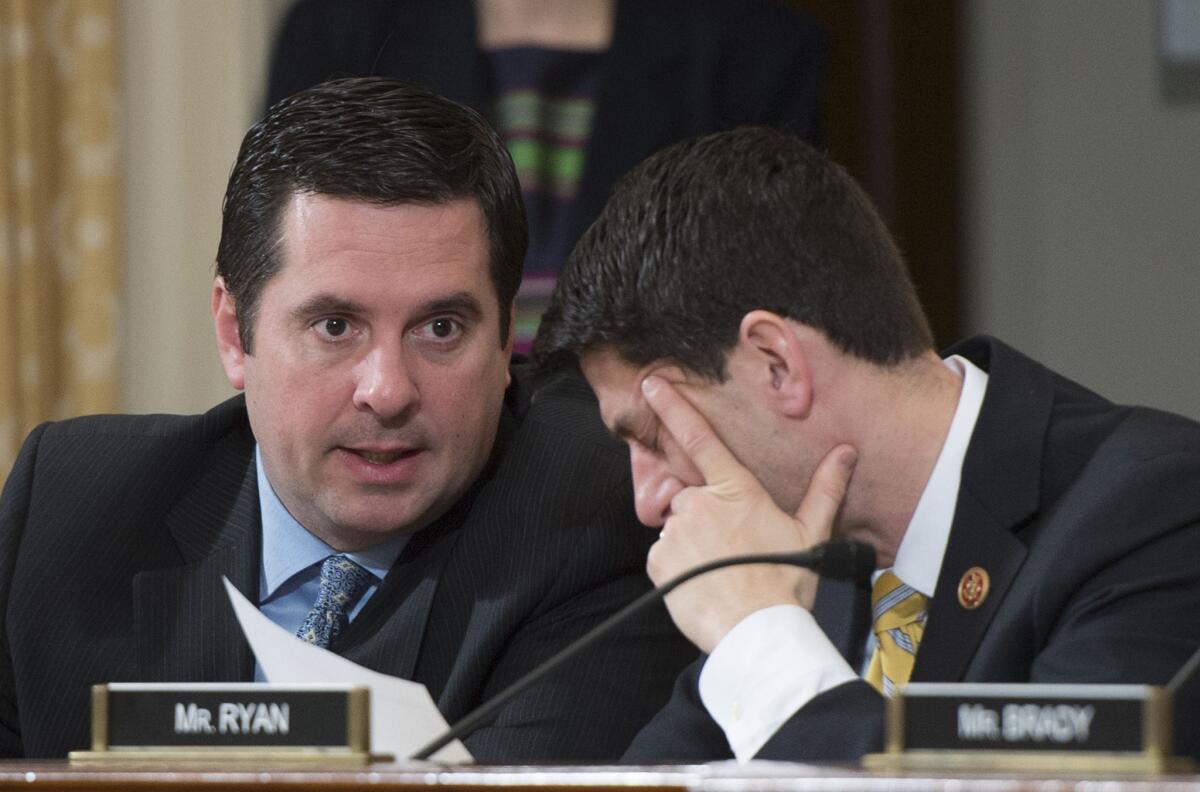 Rep. Devin Nunes, left, speaks with Rep. Paul D. Ryan (R-Wis.) at a congressional hearing. Nunes hopes to become chairman of the House Intelligence Committee.