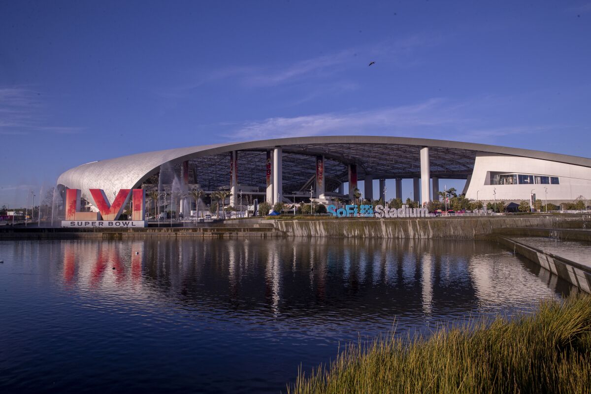 The view from the lake at SoFi Stadium in Los Angeles on Feb. 9 as workers make last-minute preparations for Super Bowl LVI.