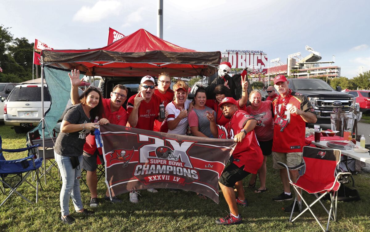 Tampa Bay Buccaneers fans tailgate outside Raymond James Stadium before Thursday's game.