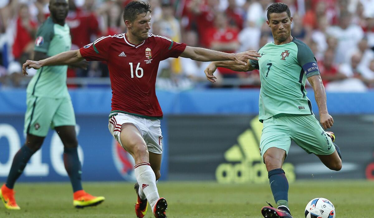 Portugal's Cristiano Ronaldo, right, in action against Hungary's Adam Pinter during an Euro 2016 Group F match on Wednesday.
