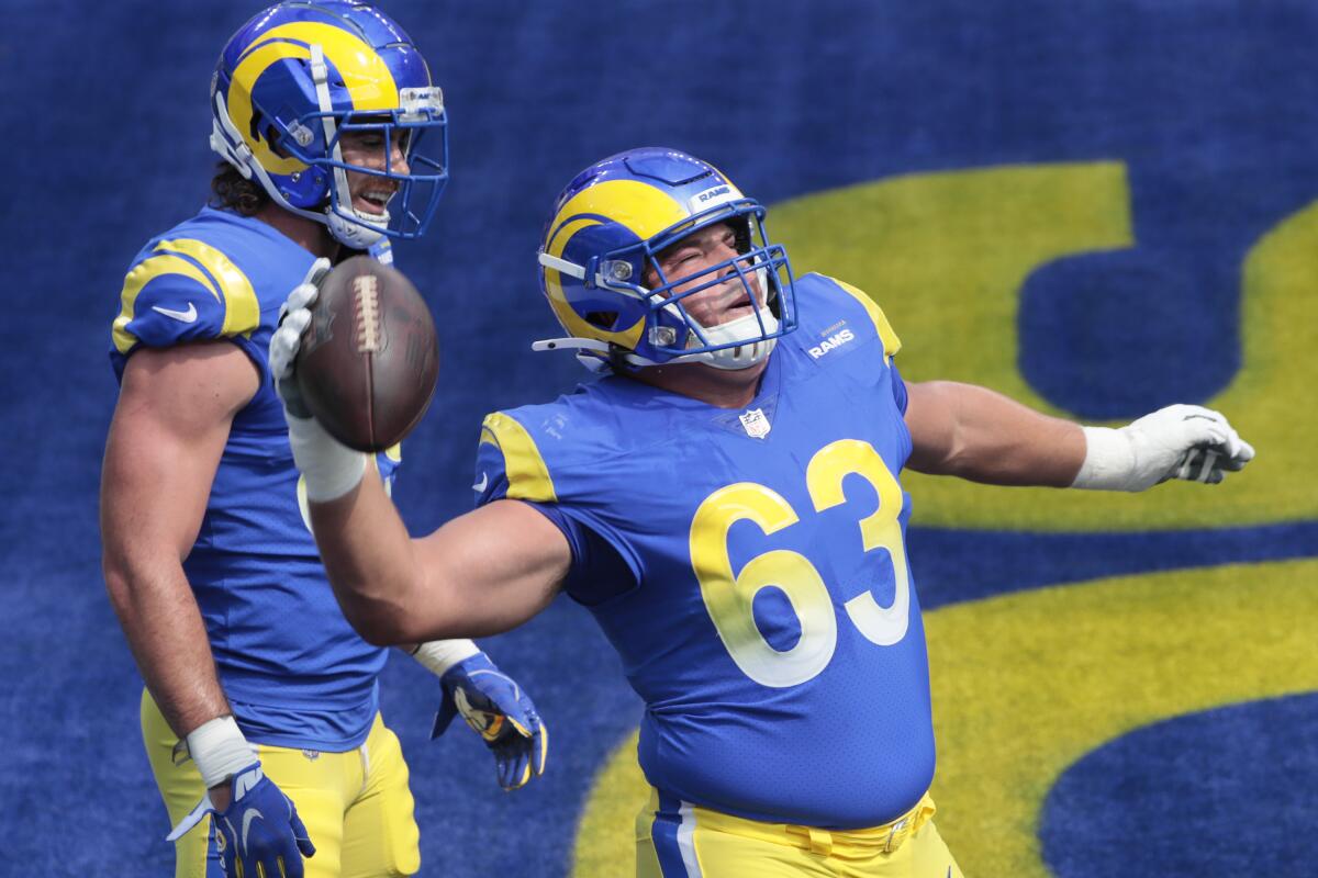  Offensive lineman Austin Corbett joyously spikes the ball after a Rams touchdown last season.