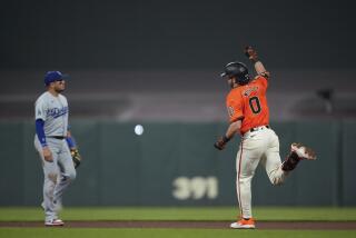 San Francisco Giants' Brett Wisely, right, celebrates after hitting a game-winning, two-run home run.