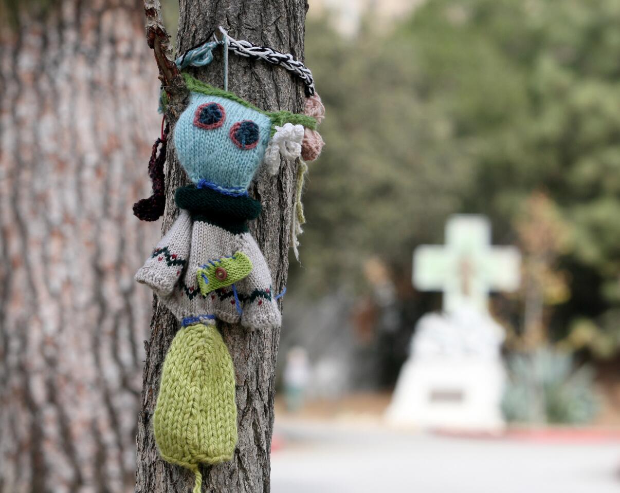 Photo Gallery: Brand Library grounds artistically yarn bombed by knit graffiti movement