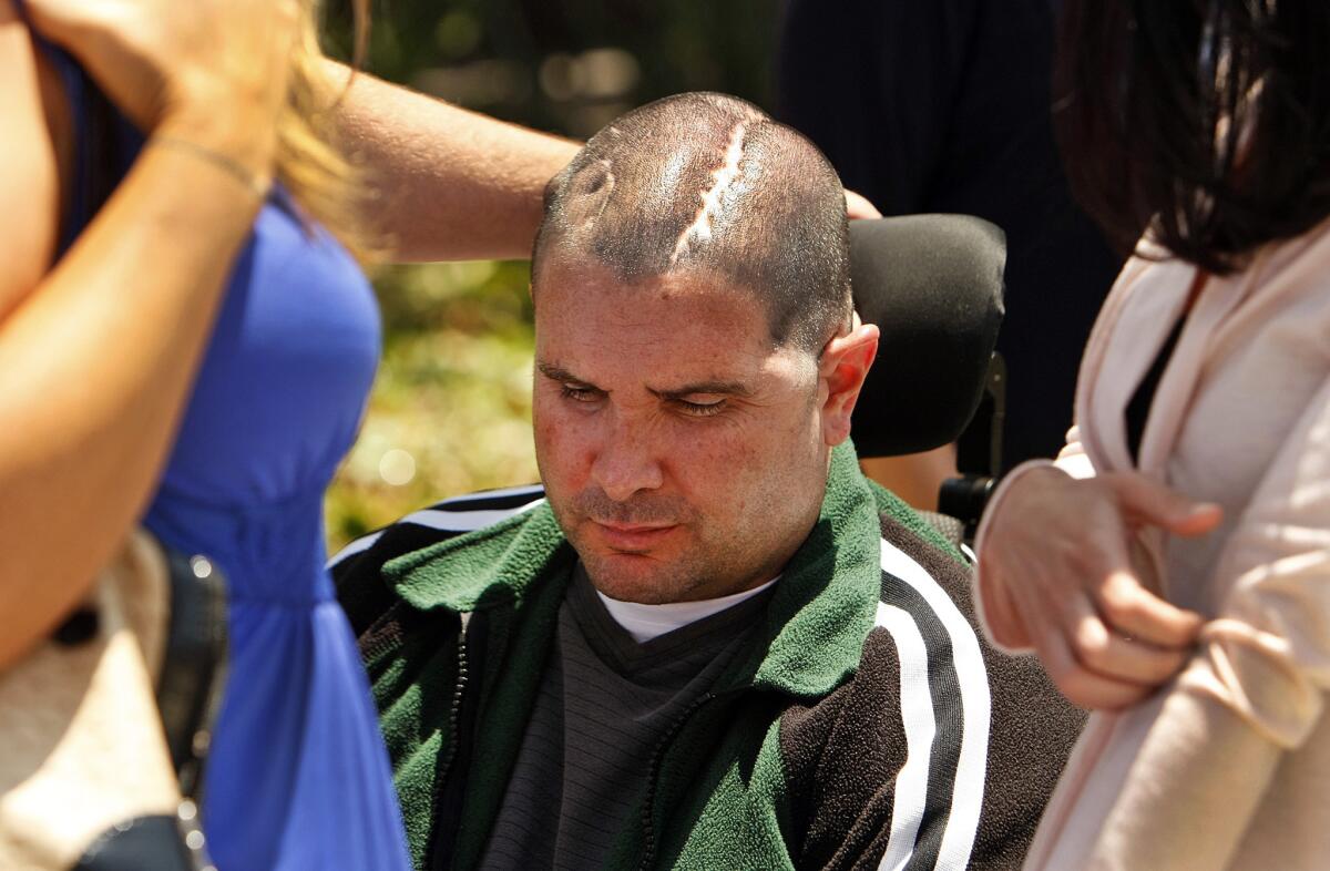 Bryan Stow leaves court in downtown Los Angeles on Wednesday after jury selection was completed in his lawsuit against the Dodgers and their former owner.