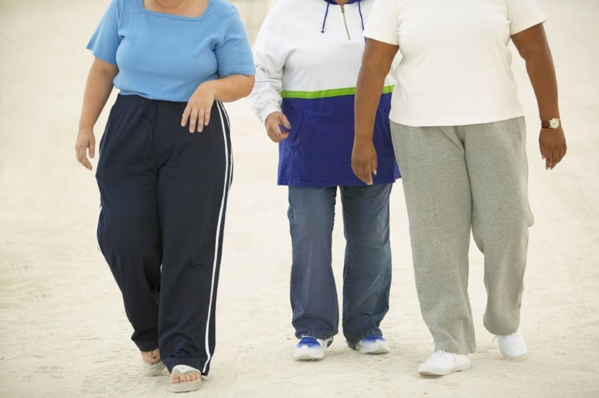 The risk of dying and of living with health complications may have more to do with where a person carries his or her fat than with how much fat a person carries, says a new study.