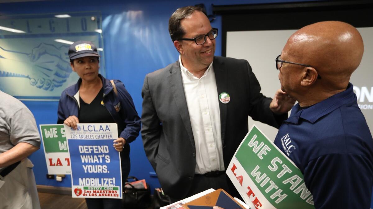 L.A. teachers union President Alex Caputo-Pearl meets with other union leaders at an October news conference near downtown.