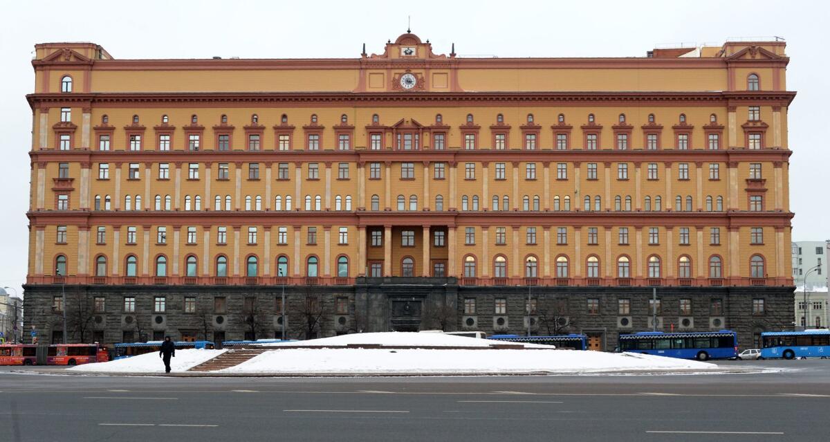 A man walks past the headquarters of the FSB, or Federal Security Service, the successor agency to the KGB, in central Moscow on Dec. 30, 2016.