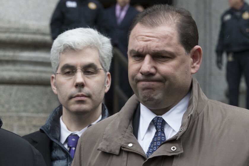 FILE- In this March 13, 2018, file photo, Joseph Percoco, right, former top aide to New York Gov. Andrew Cuomo, reacts while talking to reporters outside U.S. District court in New York. A federal appeals court has affirmed the conviction of Percoco for fraud and accepting bribes on Wednesday, Sept. 8, 2021. (AP Photo/Mary Altaffer, File)