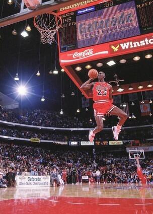 Michael Jordan flies to the hoop during the NBA Slam Dunk Contest in Chicago. Jordan went to the wire against Dominique Wilkins to win the contest.
