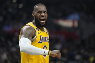 Los Angeles Lakers forward LeBron James complains after receiving a charging foul during the second half of an NBA basketball game against the Los Angeles Clippers Wednesday, Nov. 9, 2022, in Los Angeles. (AP Photo/Mark J. Terrill)