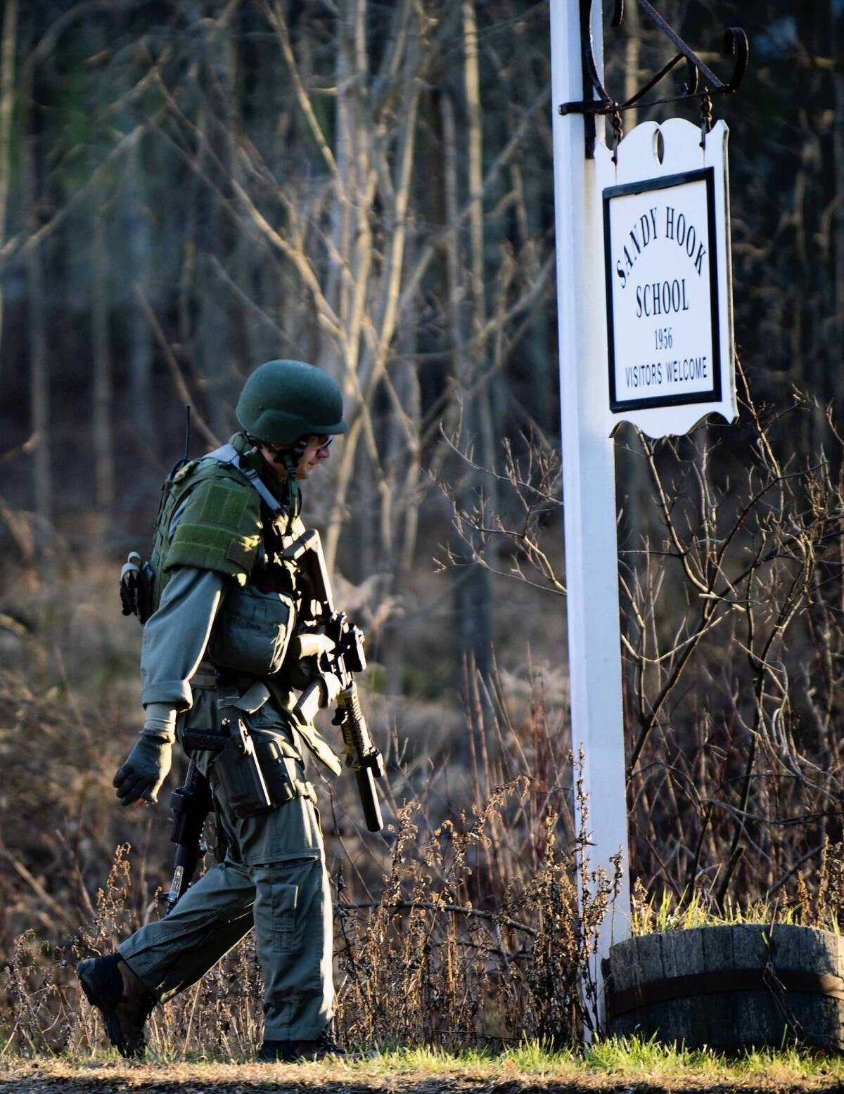 A state trooper leaves the Sandy School in Newtown, Conn., on Dec. 14, 2012.