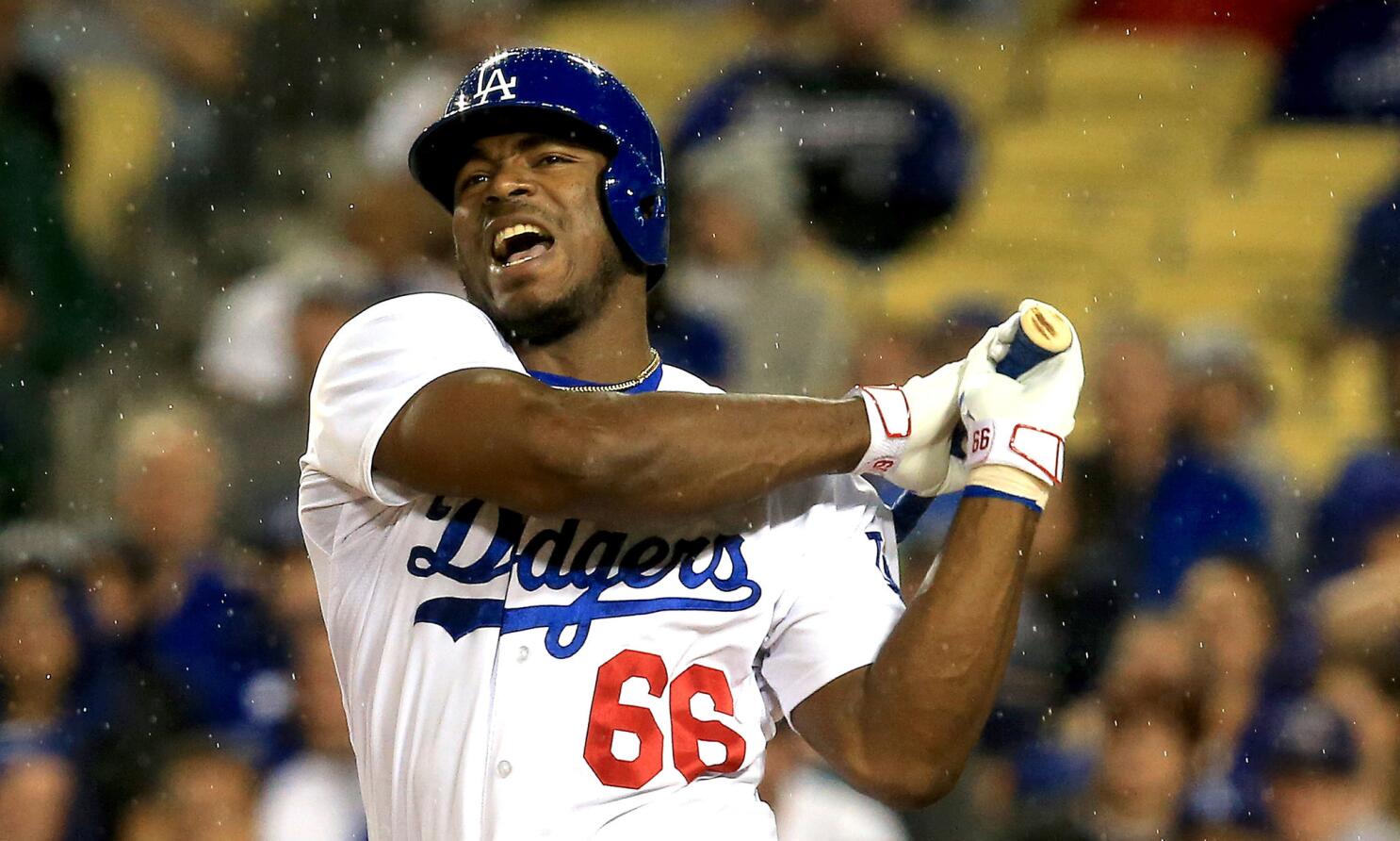 Los Angeles Dodgers second baseman Dee Gordon (L) and manager Don