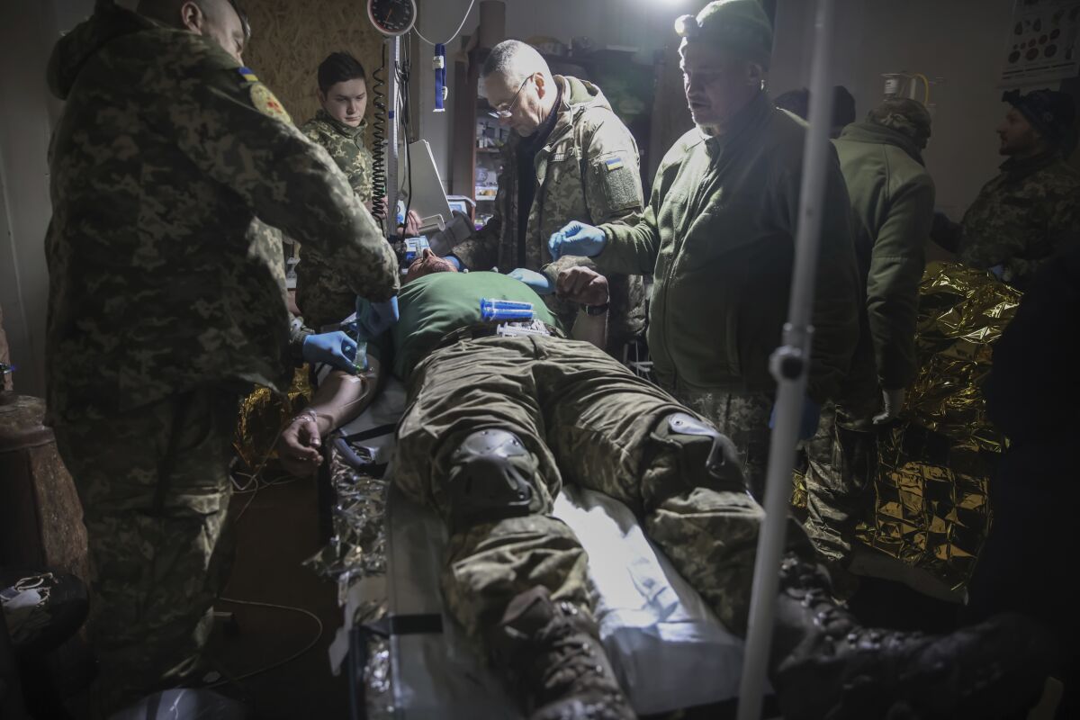 Medics tending to a wounded Ukrainian soldier