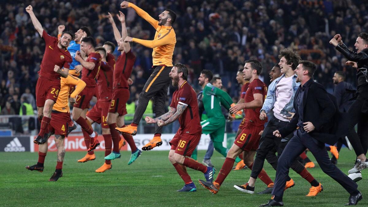 Players from AS Roma celebrate their 3-0 win against Barcelona in the quarterfinals of the UEFA Champions League last week. Roma will face Tottenham at SDCCU Stadium on July 25 as part of the International Champions Cup.