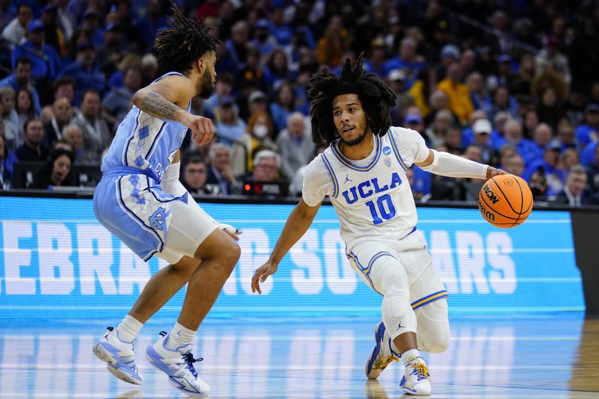 UCLA's Tyger Campbell tries to get past North Carolina's R.J. Davis.