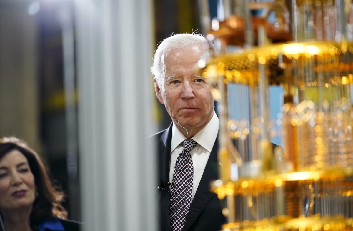 President Joe Biden looks at the IBM System One quantum computer with New York Gov. Kathy Hochul during a tour of an IBM facility in Poughkeepsie, N.Y., on Thursday Oct. 6, 2022. (AP Photo/Andrew Harnik)