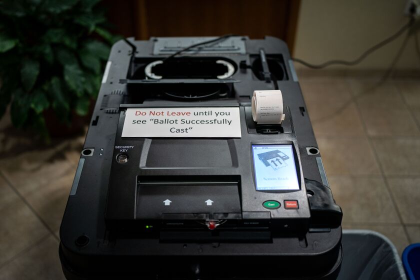 GRAND RAPIDS, MI - AUGUST 02: A dominion voting machine is setup ahead of the precinct at Christian Reform Church opening up for Michigan's Primary Election Day on Tuesday, Aug. 2, 2022 in Grand Rapids, MI. (Kent Nishimura / Los Angeles Times)
