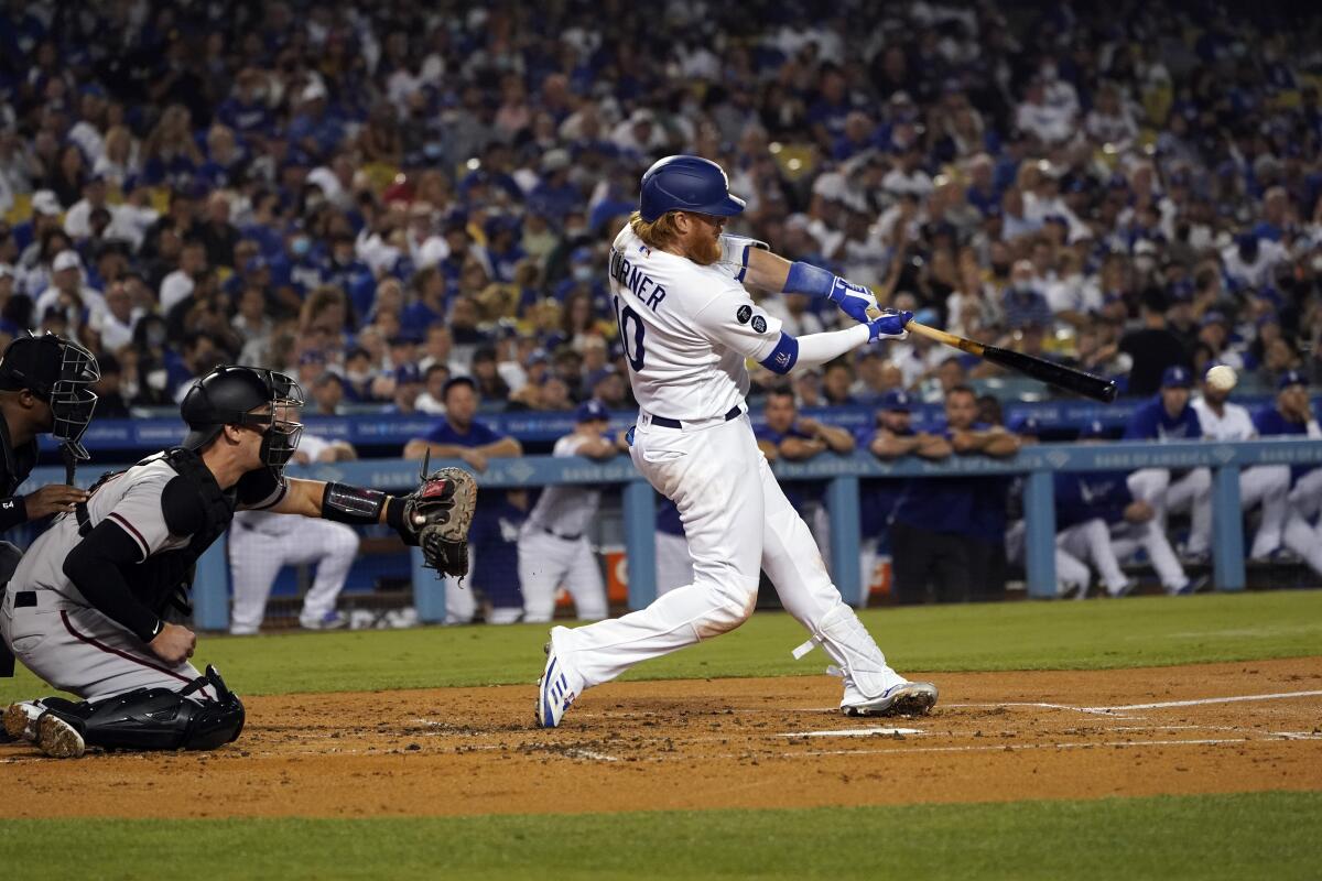 Justin Turner drives hits a two-run double in the first inning Monday.
