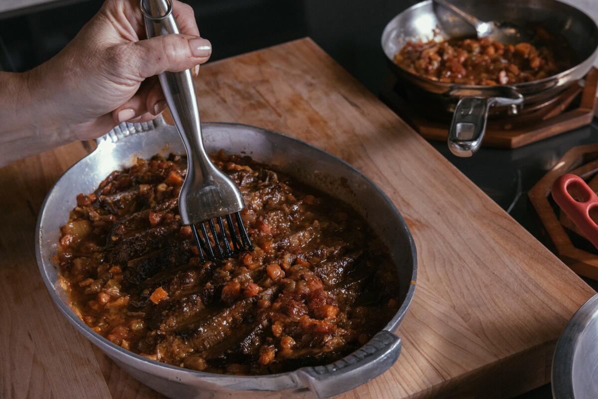 A brisket dish is plated at the Los Angeles Times' studio kitchen.